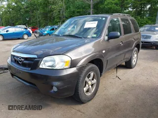 2006 Mazda Tribute LX with VIN 4F2YZ94136KM23037, listed as a IAAI auction lot 42220090 with 144,039 mi miles and . Bid and sale history available at carsss.com. Image 2.