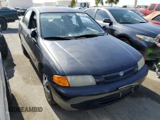 1997 Mazda Protege DX z VIN JM1BC1412V0157268, wystawiony jako Copart lot #61380564 z przebiegiem 85 356 mil mil oraz Szkoda całkowita • Salvage title. Historia ofert i sprzedaży dostępna na DreamBid. Obrazek 4.