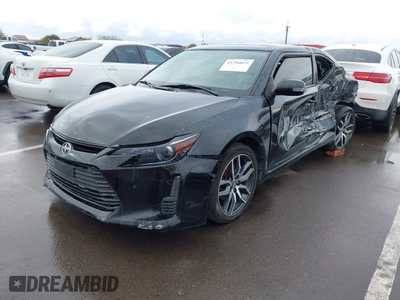 2015 Scion tC with VIN JTKJF5C79FJ003404, listed as a IAAI auction lot 41756024 with 128,906 mi miles. Bid and sale history available at carsss.com. Image 2.