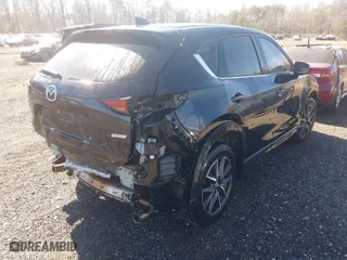 2017 Mazda CX-5 Grand Touring with VIN JM3KFBDL0H0228056, listed as a IAAI auction lot 41611567 with 85,294 mi miles. Bid and sale history available at carsss.com. Image 4.