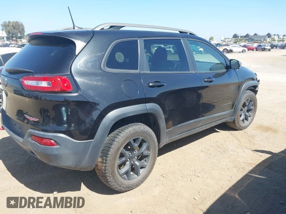 2016 Jeep Cherokee Trailhawk with VIN 1C4PJMBB9GW179051, listed as a IAAI auction lot 42520342 with 100,538 mi miles and . Bid and sale history available at DreamBid. Image 4.