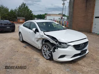 2016 Mazda 6 i Touring with VIN JM1GJ1V52G1453126, listed as a IAAI auction lot 42459635 with 146,343 mi miles and . Bid and sale history available at DreamBid. Image 1.