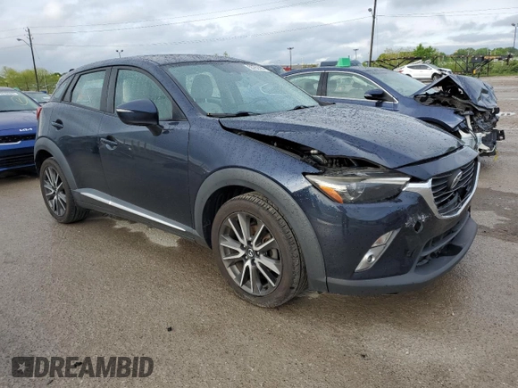 2017 Mazda CX-3 Grand Touring z VIN JM1DKFD75H0141048, wystawiony jako Copart lot #55752185 z przebiegiem 89 960 mil mil oraz Szkody całkowita. Historia ofert i sprzedaży dostępna na DreamBid. Obrazek 4.