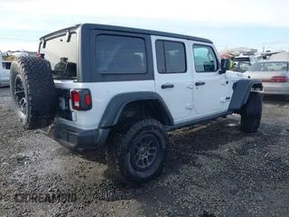 2023 Jeep Wrangler Sport with VIN 1C4HJXDG4PW567027, listed as a IAAI auction lot 41633197 with 14,782 mi miles and . Bid and sale history available at DreamBid. Image 4.
