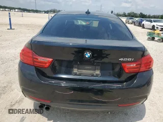 2015 BMW 4 Series 428i z VIN WBA4A5C54FG051212, wystawiony jako Copart lot #59479495 z przebiegiem 126 497 mil mil oraz Szkoda całkowita • Salvage title. Historia ofert i sprzedaży dostępna na DreamBid. Obrazek 6.