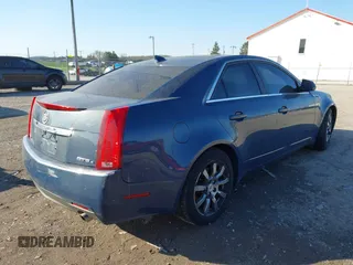 2009 Cadillac CTS AWD w/1SB with VIN 1G6DT57V290143815, listed as a IAAI auction lot 42000863 with 139,340 mi miles. Bid and sale history available at carsss.com. Image 4.