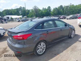 2017 Ford Focus Titanium with VIN 1FADP3J27HL306546, listed as a IAAI auction lot 42480576 with 114,285 mi miles and . Bid and sale history available at DreamBid. Image 4.
