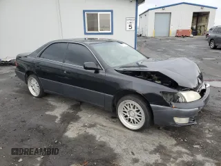 1997 Lexus ES 300 Luxury Sport Sdn with VIN JT8BF22G5V0057703, listed as a Copart auction lot 84712734 with 160,575 mi miles and Salvage Title. Bid and sale history available at carsss.com. Image 4.