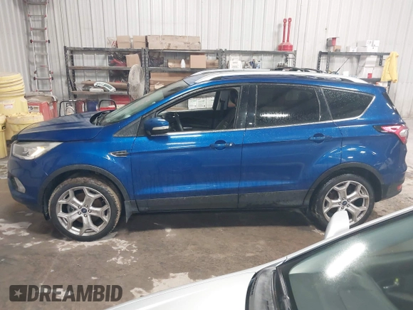 2018 Ford Escape Titanium with VIN 1FMCU9J99JUB94925, listed as a IAAI auction lot 42412800 with 95,880 mi miles and . Bid and sale history available at DreamBid. Image 15.