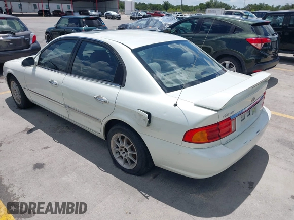 2002 Kia Optima LX z VIN KNAGD126325144218, wystawiony jako IAAI lot #42596691 z przebiegiem 220 972 mil mil oraz . Historia ofert i sprzedaży dostępna na DreamBid. Obrazek 3.