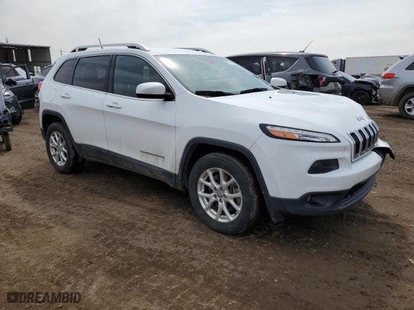 2015 Jeep Cherokee Latitude with VIN 1C4PJMCS6FW773657, listed as a Copart auction lot 51110215 with 132,928 mi miles and Salvage Title. Bid and sale history available at carsss.com. Image 4.