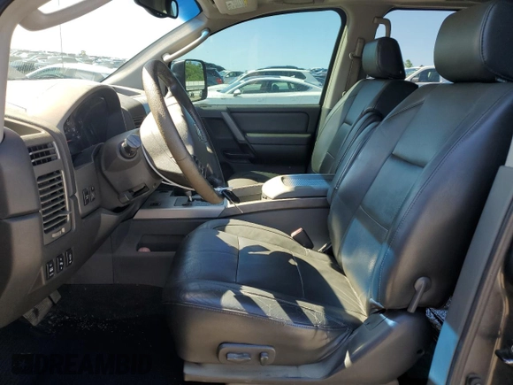 2005 Nissan Titan LE with VIN 1N6BA07B95N571880, listed as a Copart auction lot 57527435 with 199,577 mi miles and Salvage title. Bid and sale history available at DreamBid. Image 7.