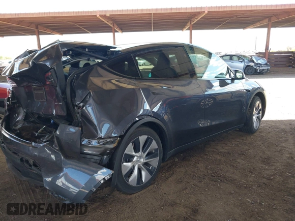 2023 Tesla Model Y Long Range with VIN 7SAYGDEE4PF875915, listed as a IAAI auction lot 42095178 with 11,928 mi miles and . Bid and sale history available at DreamBid. Image 4.