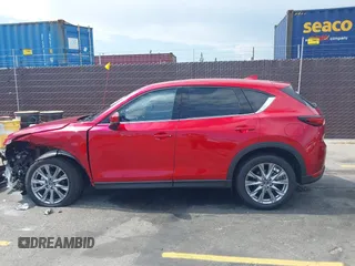 2021 Mazda CX-5 Grand Touring with VIN JM3KFADM6M1373111, listed as a IAAI auction lot 42784431 with 14,374 mi miles and . Bid and sale history available at DreamBid. Image 14.
