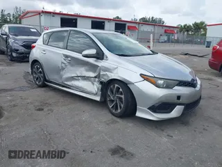 2018 Toyota Corolla iM with VIN JTNKARJE6JJ569706, listed as a IAAI auction lot 41612375 with 214,063 mi miles. Bid and sale history available at carsss.com. Image 1.
