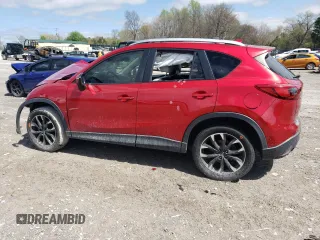2016 Mazda CX-5 Grand Touring with VIN JM3KE2DY5G0692554, listed as a Copart auction lot 51322475 with 128,086 mi miles and Salvage Title. Bid and sale history available at carsss.com. Image 2.