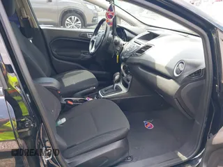 2016 Ford Fiesta SE with VIN 3FADP4EJ2GM150453, listed as a IAAI auction lot 42104235 with 124,423 mi miles and . Bid and sale history available at carsss.com. Image 5.