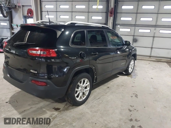 2015 Jeep Cherokee Latitude with VIN 1C4PJMCB5FW768854, listed as a IAAI auction lot 41246213 with 131,112 mi miles. Bid and sale history available at carsss.com. Image 4.