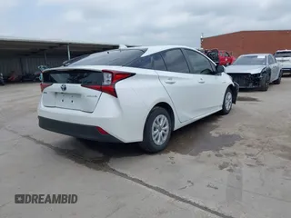2022 Toyota Prius L Eco with VIN JTDKAMFUXN3157225, listed as a IAAI auction lot 39292379 with 59,333 mi miles and . Bid and sale history available at DreamBid. Image 4.