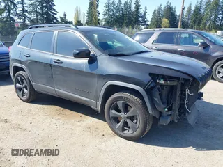 2015 Jeep Cherokee North with VIN 1C4PJMCS3FW777973, listed as a IAAI auction lot 42043203 with 158,536 mi miles. Bid and sale history available at carsss.com. Image 1.