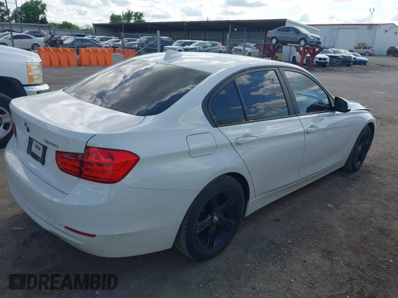 2014 BMW 3 Series 328i with VIN WBA3A5C5XEJ463938, listed as a IAAI auction lot 42103330 with 194,263 mi miles and . Bid and sale history available at DreamBid. Image 4.