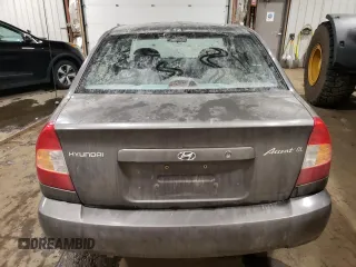 2000 Hyundai Accent z VIN KMHCG45G4YU090520, wystawiony jako Copart lot #79705864 z przebiegiem 145 490 mil mil oraz Szkoda całkowita • Salvage title. Historia ofert i sprzedaży dostępna na DreamBid. Obrazek 6.