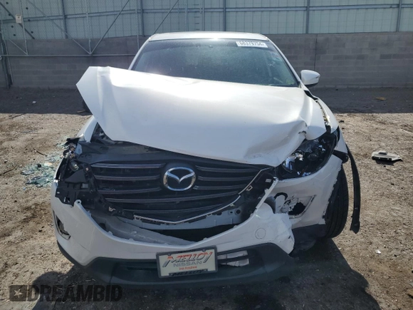 2016 Mazda CX-5 Grand Touring with VIN JM3KE2DY0G0888854, listed as a Copart auction lot 68379754 with 73,096 mi miles and Salvage Title. Bid and sale history available at carsss.com. Image 5.