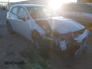 2017 Mazda CX-3 Touring z VIN JM1DKDC78H0165432, wystawiony jako IAAI lot #41035194 z przebiegiem 130 499 mil mil oraz . Historia ofert i sprzedaży dostępna na DreamBid. Obrazek 1.