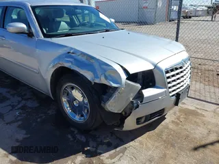 2006 Chrysler 300 Touring with VIN 2C3KA53G86H111027, listed as a IAAI auction lot 41870312 with 59,870 mi miles. Bid and sale history available at carsss.com. Image 6.