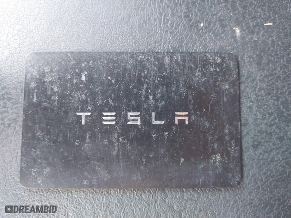 2018 Tesla Model 3 Long Range Battery with VIN 5YJ3E1EA4JF157782, listed as a IAAI auction lot 41774169 with 123,239 mi miles. Bid and sale history available at carsss.com. Image 11.