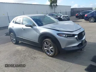 2021 Mazda CX-30 Preferred z VIN 3MVDMBCL5MM312694, wystawiony jako IAAI lot #41920487 z przebiegiem 6 678 mil mil oraz . Historia ofert i sprzedaży dostępna na DreamBid. Obrazek 1.