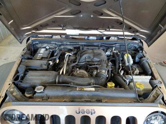 2015 Jeep Wrangler Unlimited Freedom with VIN 1C4BJWDG5FL713046, listed as a Copart auction lot 58563455 with 144,179 mi miles and Salvage title. Bid and sale history available at DreamBid. Image 12.