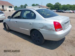2003 Hyundai Elantra GLS z VIN KMHDN45D63U571345, wystawiony jako IAAI lot #39897105 z przebiegiem 156 805 mil mil oraz . Historia ofert i sprzedaży dostępna na DreamBid. Obrazek 3.