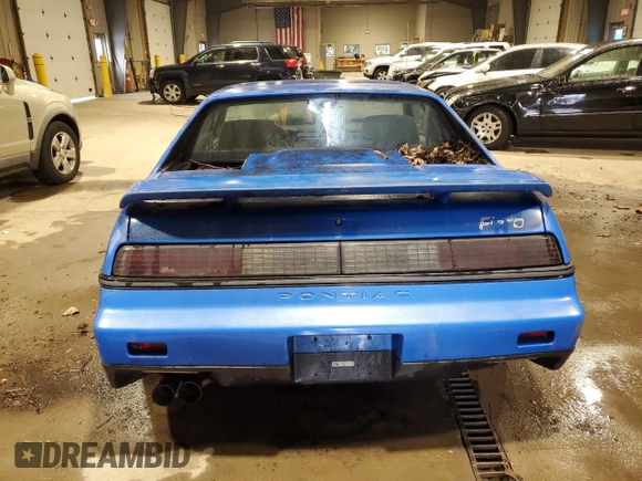 1987 Pontiac Fiero z VIN 1G2PF11R6HP237261, wystawiony jako Copart lot #85061534 z przebiegiem Nie podano mil oraz Czysty tytuł • Clean title. Historia ofert i sprzedaży dostępna na DreamBid. Obrazek 6.