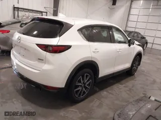 2017 Mazda CX-5 Grand Touring with VIN JM3KFBDL1H0203358, listed as a IAAI auction lot 41526776 with 63,167 mi miles. Bid and sale history available at carsss.com. Image 4.