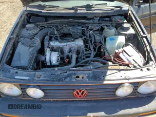 1991 Volkswagen GTI z VIN 3VWDB21G7MM023746, wystawiony jako Copart lot #66414904 z przebiegiem 105 926 mil mil oraz Nie do naprawy • Non repairable. Historia ofert i sprzedaży dostępna na DreamBid. Obrazek 11.
