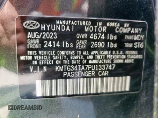 2023 Genesis G70 2.0T with VIN KMTG34TA7PU133747, listed as a Copart auction lot 56338345 with 27,190 mi miles and Salvage title. Bid and sale history available at DreamBid. Image 12.