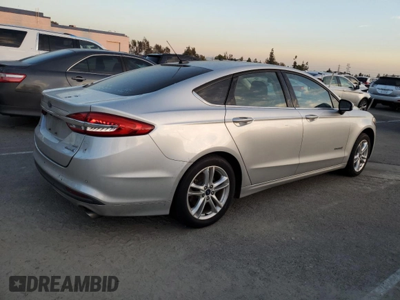 2018 Ford Fusion Hybrid SE with VIN 3FA6P0LU1JR154373, listed as a Copart auction lot 82924614 with 133,065 mi miles and Salvage Title. Bid and sale history available at carsss.com. Image 3.