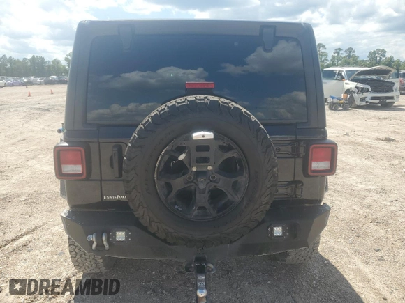 2021 Jeep Wrangler Unlimited Willys with VIN 1C4HJXDN0MW859686, listed as a Copart auction lot 56657725 with 49,984 mi miles and Salvage title. Bid and sale history available at DreamBid. Image 6.