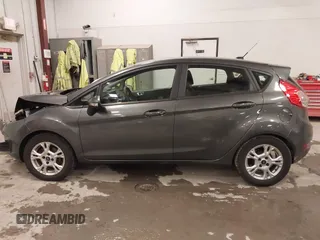 2015 Ford Fiesta SE z VIN 3FADP4EJ8FM138306, wystawiony jako IAAI lot #41227124 z przebiegiem 106 741 mil mil oraz . Historia ofert i sprzedaży dostępna na DreamBid. Obrazek 14.