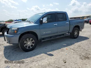 2011 Nissan Titan SL with VIN 1N6AA0EC4BN305296, listed as a Copart auction lot 59001395 with 194,557 mi miles and Salvage title. Bid and sale history available at DreamBid. Image 1.