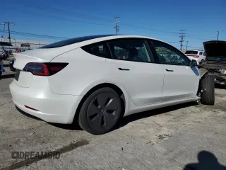 2023 Tesla Model 3 with VIN 5YJ3E1EA7PF557358, listed as a Copart auction lot 48891985 with 20,673 mi miles and Salvage title. Bid and sale history available at DreamBid. Image 3.