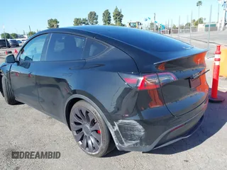 2022 Tesla Model Y Performance with VIN 7SAYGDEF5NF336693, listed as a IAAI auction lot 41805752 with 42,009 mi miles and . Bid and sale history available at DreamBid. Image 3.