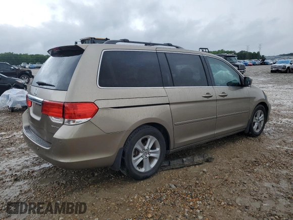 2010 Honda Odyssey Touring z VIN 5FNRL3H97AB082525, wystawiony jako Copart lot #56410845 z przebiegiem 94 819 mil mil oraz Szkoda całkowita • Salvage title. Historia ofert i sprzedaży dostępna na DreamBid. Obrazek 3.