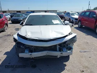 2018 Chevrolet Impala LT with VIN 1G1105S34JU106107, listed as a IAAI auction lot 41871693 with 111,412 mi miles and . Bid and sale history available at DreamBid. Image 12.