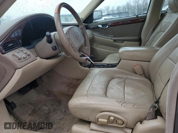 2004 Cadillac DeVille DTS z VIN 1G6KF57944U117834, wystawiony jako Copart lot #89320975 z przebiegiem 149 820 mil mil oraz Szkody całkowita. Historia ofert i sprzedaży dostępna na DreamBid. Obrazek 7.