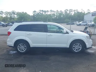 2015 Dodge Journey SXT with VIN 3C4PDCBG0FT653857, listed as a IAAI auction lot 42128410 with 182,960 mi miles and . Bid and sale history available at DreamBid. Image 13.