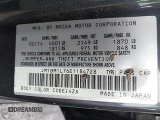 2014 Mazda 3 i Touring with VIN JM1BM1L76E1184728, listed as a IAAI auction lot 41962258 with 200,544 mi miles and . Bid and sale history available at DreamBid. Image 9.