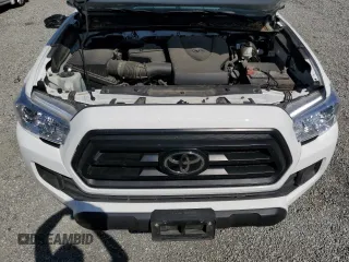 2023 Toyota Tacoma SR z VIN 3TMCZ5AN5PM594103, wystawiony jako Copart lot #52957955 z przebiegiem 21 759 mil mil oraz Szkoda całkowita • Salvage title. Historia ofert i sprzedaży dostępna na DreamBid. Obrazek 11.