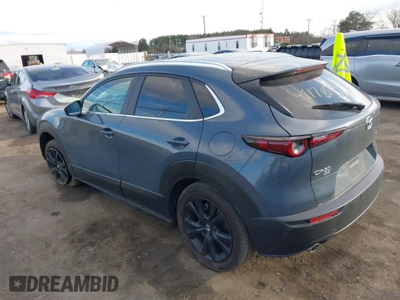 2023 Mazda CX-30 S Carbon Edition with VIN 3MVDMBCM1PM573317, listed as a IAAI auction lot 41785371 with 6,475 mi miles and . Bid and sale history available at DreamBid. Image 3.